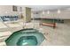 Beautiful indoor pool and hot tub area with comfortable seating at 3333 S Atlantic Ave # 1802, Daytona Beach, FL 32118