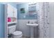 Well-lit bathroom with a vanity sink, and a shower and tub combination at 354 Fir St, Ormond Beach, FL 32174