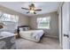 Cozy bedroom with a neutral color scheme, bright natural light, and a ceiling fan at 354 Fir St, Ormond Beach, FL 32174