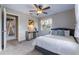 Comfortable bedroom with a ceiling fan, lots of natural light, and neutral-colored walls at 354 Fir St, Ormond Beach, FL 32174