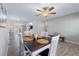 Dining area with modern table set and seamless flow to kitchen and living spaces at 354 Fir St, Ormond Beach, FL 32174