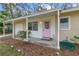 Welcoming front entrance with a bright pink door and a covered porch at 354 Fir St, Ormond Beach, FL 32174