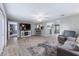 Spacious open living area with wood-look floors and an open transition into the kitchen at 354 Fir St, Ormond Beach, FL 32174