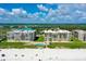 Aerial view showcasing the beachfront condos, sparkling pool, and direct beach access at 4555 S Atlantic Ave # 4609, Port Orange, FL 32127