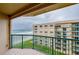 Balcony view showcasing the ocean, a nearby building, and the balcony's green railing at 4555 S Atlantic Ave # 4609, Port Orange, FL 32127