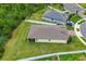 An aerial view shows a home with a large lawn and fenced yard near a cul-de-sac and wooded area at 806 Armenia Ct, New Smyrna Beach, FL 32168