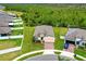 Aerial view of a home and well manicured yard in a Gathering friendly neighborhood at 806 Armenia Ct, New Smyrna Beach, FL 32168