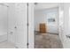 Bathroom features a shower/tub combo, plush carpet, and a wood dresser in the connected bedroom at 806 Armenia Ct, New Smyrna Beach, FL 32168