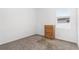 Neutral bedroom features plush carpeting, natural light, and a wood dresser for storage at 806 Armenia Ct, New Smyrna Beach, FL 32168