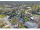 Aerial view of a desirable neighborhood featuring a home with a fenced yard and mature trees at 906 Timberwood Dr, Port Orange, FL 32127