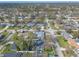 An elevated aerial shot showcases the charming neighborhood and street layout at 906 Timberwood Dr, Port Orange, FL 32127