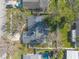 A direct aerial shot highlights the home's layout, backyard, and surrounding greenery at 906 Timberwood Dr, Port Orange, FL 32127