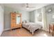 Bright bedroom with natural light, hardwood floors, and a cozy bed at 906 Timberwood Dr, Port Orange, FL 32127