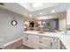 Well-lit kitchen showcasing a center island, dining area, and view into the living space at 906 Timberwood Dr, Port Orange, FL 32127