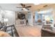 Spacious living room showcasing wood floors and an open layout to the dining room at 906 Timberwood Dr, Port Orange, FL 32127