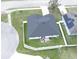 Aerial view of the home's backyard, showing its outdoor space and fencing with patio furniture at 113 Plumosus Park Dr, Deland, FL 32724