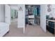 Spacious walk-in closet with shelving and plentiful storage solutions for shoes and folded clothing at 113 Plumosus Park Dr, Deland, FL 32724