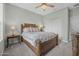 Bedroom with a queen-sized bed, ceiling fan, and a closet with sliding doors at 1143 Champions Dr, Daytona Beach, FL 32124