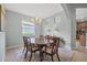 Charming dining area featuring a chandelier, neutral decor, and an adjacent window at 1143 Champions Dr, Daytona Beach, FL 32124