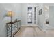 Inviting foyer with tiled flooring and a decorative console table, leading to the main living area at 1143 Champions Dr, Daytona Beach, FL 32124