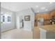 Bright breakfast nook adjacent to kitchen, featuring ample natural light, and modern stainless steel appliances at 1143 Champions Dr, Daytona Beach, FL 32124