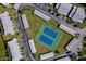 Aerial view featuring community tennis courts surrounded by villas and well-maintained landscaping at 150 Limewood Pl # F, Ormond Beach, FL 32174