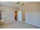 Bedroom with ceiling fan, sliding closet doors, and views offers a comfortable and functional living space at 150 Limewood Pl # F, Ormond Beach, FL 32174