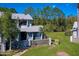 Shot of a well-maintained condo with lush green lawn and beautiful mature palm trees at 150 Limewood Pl # F, Ormond Beach, FL 32174