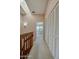 Upstairs hallway with closet space leads to a carpeted bedroom with natural light at 150 Limewood Pl # F, Ormond Beach, FL 32174