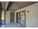 Enclosed patio space with tile floors and sliding glass doors to the outdoors at 150 Limewood Pl # F, Ormond Beach, FL 32174