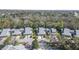 Aerial view of the townhomes, showcasing mature landscaping, parking, and proximity to roadways at 25 Misners Trl, Ormond Beach, FL 32174