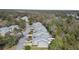 Aerial view of a row of townhomes in a wooded community, showcasing the peaceful setting at 25 Misners Trl, Ormond Beach, FL 32174