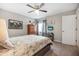 Cozy bedroom featuring a ceiling fan, television, and a comfortable-looking bed at 25 Misners Trl, Ormond Beach, FL 32174