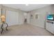 Bright bedroom with a white closet, tropical decor, and a TV at 25 Misners Trl, Ormond Beach, FL 32174