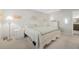 Bright, airy bedroom with white furniture and a large bed at 25 Misners Trl, Ormond Beach, FL 32174