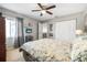 Bedroom with a large bed, ceiling fan, and closet doors at 25 Misners Trl, Ormond Beach, FL 32174