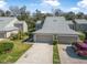 Aerial view of home with two-car garage and well-maintained landscaping at 25 Misners Trl, Ormond Beach, FL 32174