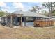 Backyard view showcasing a hot tub, patio, and well-maintained outdoor space at 290 Birch Ave, Orange City, FL 32763