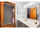 Bathroom featuring a gray vanity with a white countertop and wood accents at 290 Birch Ave, Orange City, FL 32763