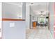 Bright foyer with tile flooring leading to a dining area with a small table at 290 Birch Ave, Orange City, FL 32763