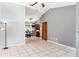 Open-concept living area featuring tile floors, a ceiling fan and view of the kitchen at 290 Birch Ave, Orange City, FL 32763