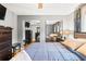 View of the main bedroom featuring mirrored closet doors and neutral gray walls at 290 Birch Ave, Orange City, FL 32763