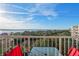 Condo balcony with waterfront views and a comfortable seating area at 3 Oceans West Blvd # 7C6, Daytona Beach, FL 32118