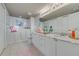 Bathroom featuring a marble countertop and flamingo decoration at 3 Oceans West Blvd # 7C6, Daytona Beach, FL 32118