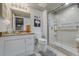 Bathroom featuring a white cabinet and a glass enclosed shower at 3 Oceans West Blvd # 7C6, Daytona Beach, FL 32118