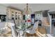 Formal dining room with glass table and elegant china cabinet at 3 Oceans West Blvd # 7C6, Daytona Beach, FL 32118