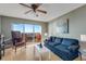 Cozy living room provides a comfortable seating area with hardwood floors and access to a private balcony at 3 Oceans West Blvd # 7C6, Daytona Beach, FL 32118