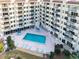 Beautiful pool area with lounge chairs and manicured landscaping, perfect for relaxation at 3 Oceans West Blvd # 7C6, Daytona Beach, FL 32118