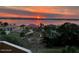 Scenic view of waterfront homes at sunset, capturing a serene and picturesque neighborhood ambiance at 3 Oceans West Blvd # 7C6, Daytona Beach Shores, FL 32118
