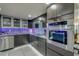 A sleek kitchen features stainless steel appliances, dark cabinets, and stylish countertops for a modern cooking space at 3 Oceans West Blvd # 7C6, Daytona Beach Shores, FL 32118
